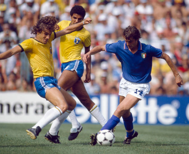 Marco Tardelli of Italy is tackled by Oscar of Brazil during the Italy v Brazil World Cup match played at the Estadio Sarria in Barcelona, Spain on...