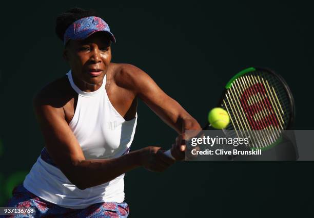 Venus Williams of the United States plays a backhand against Natalia Vikhlyantseva of Russia in their second round match during the Miami Open...