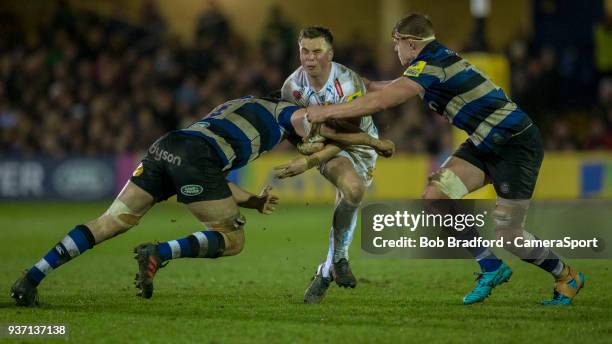 Exeter Chiefs' Joe Simmonds is tackled by Bath Rugby's Tom Ellis and Charlie Ewels during the Aviva Premiership match between Bath Rugby and Exeter...