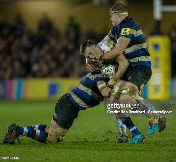 Exeter Chiefs' Joe Simmonds is tackled by Bath Rugby's Tom Ellis and Charlie Ewels during the Aviva Premiership match between Bath Rugby and Exeter...