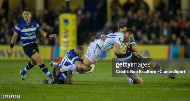 Exeter Chiefs' Phil Dollman is tackled by Bath Rugby's Jonathan Joseph and James Wilson during the Aviva Premiership match between Bath Rugby and...