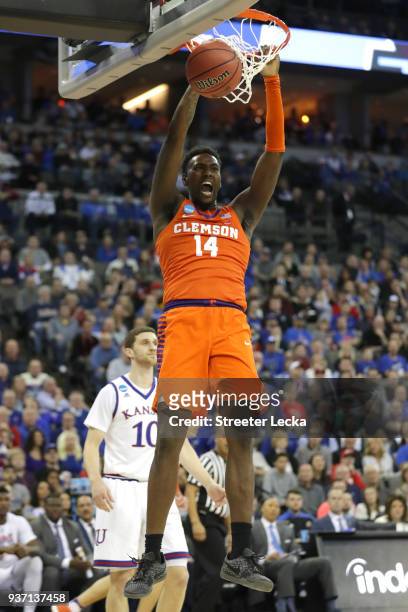 Elijah Thomas of the Clemson Tigers dunks the ball against the Kansas Jayhawks during the first half in the 2018 NCAA Men's Basketball Tournament...