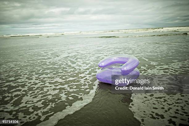 inflatable chair on the beach - bubble chair stock-fotos und bilder