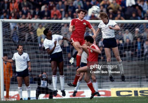 Mark Wright of England heads away from Marcel Coras of Romania during their World Cup Qualifying match held in Bucharest, Romania on 1st May 1985....