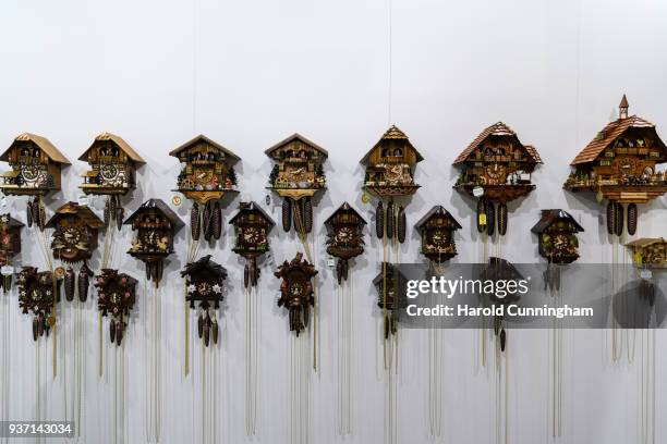 Hubert Herr cuckoo clocks are displayed at the BaselWolrd watch fair on March 23, 2018 in Basel, Switzerland. The annual watch trade fair sees the...