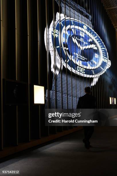 Visitor walks by a giant watch display on the Blancpain booth at the BaselWolrd watch fair on March 23, 2018 in Basel, Switzerland. The annual watch...