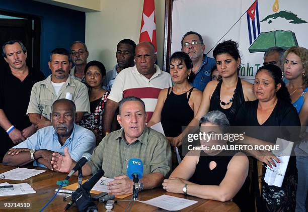 Cuban Government opponent Francisco Chaviano speaks flanked by Felix Bonne and Gisela Delgado during a press conference on December 3 in Havana,...