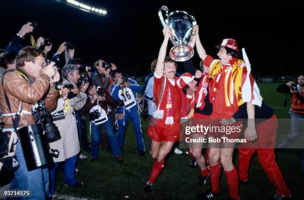Liverpool's Graeme Souness and Alan Hansen pose with the trophy after their match with Real Madrid in the European Cup Final held at the Parc des...