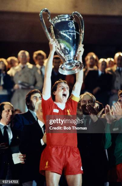 Liverpool captain Phil Thompson holds the trophy after the match between Liverpool and Real Madrid in the European Cup Final held at the Parc des...