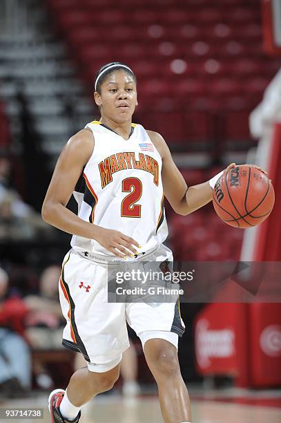 Dara Taylor of the Maryland Terrapins brings the ball up the floor against the New Hampshire Wildcats at the Comcast Center on November 16, 2009 in...