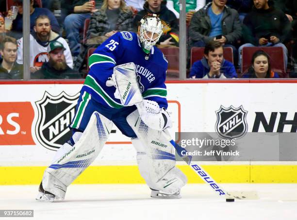 Jacob Markstrom of the Vancouver Canucks plays the puck during their NHL game against the New York Islanders at Rogers Arena March 5, 2018 in...