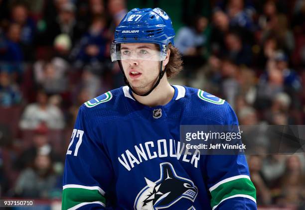 Ben Hutton of the Vancouver Canucks looks on from the bench during their NHL game against the New York Islanders at Rogers Arena March 5, 2018 in...