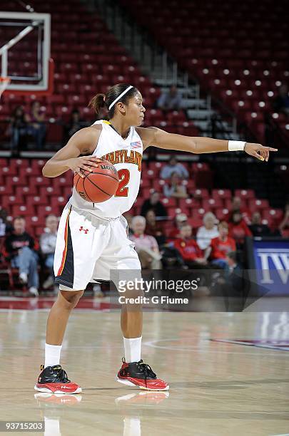Dara Taylor of the Maryland Terrapins brings the ball up the floor against the New Hampshire Wildcats at the Comcast Center on November 16, 2009 in...