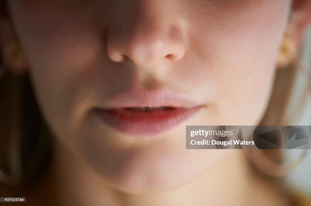 Close up of woman's moth and nose.