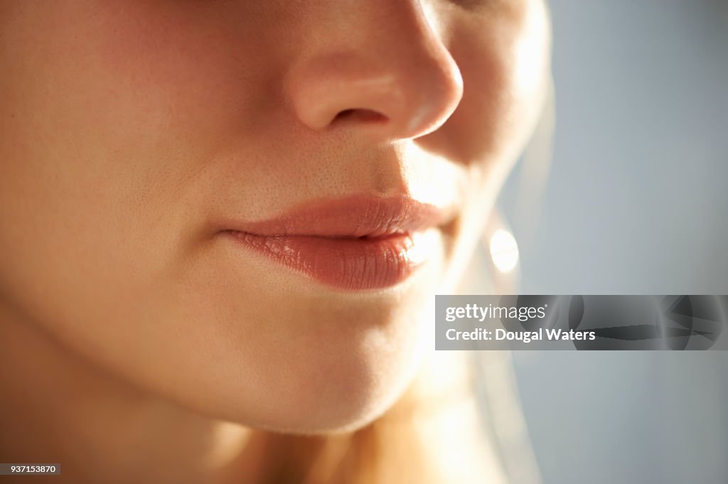 Close up of female mouth and nose.