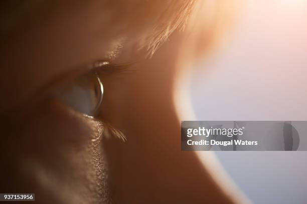 close up of female eye profile. - close up eye side stock pictures, royalty-free photos & images