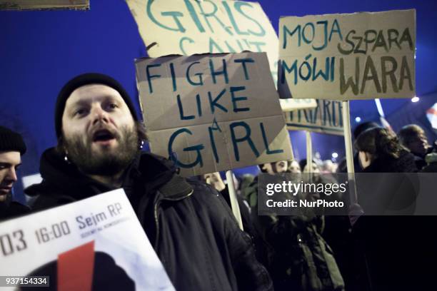 Man holds banner during strike against restrictions in Abortion Law in Warsaw on March 23, 2018