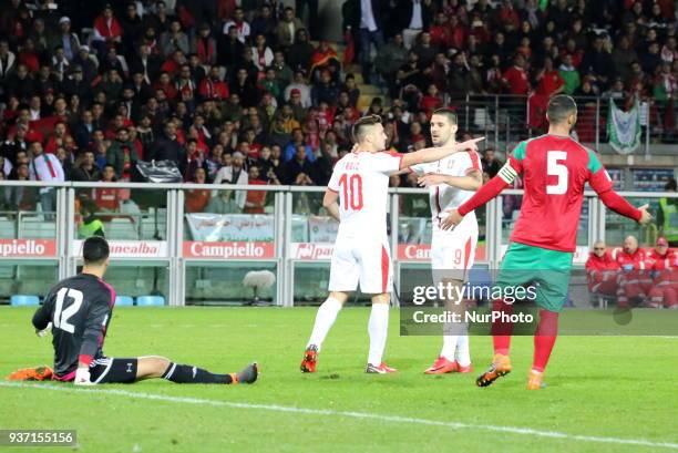 Dusan Tadic celebrates with teammates after scouring during the international friendly football match between Marocco and Serbia at Olympic Grande...