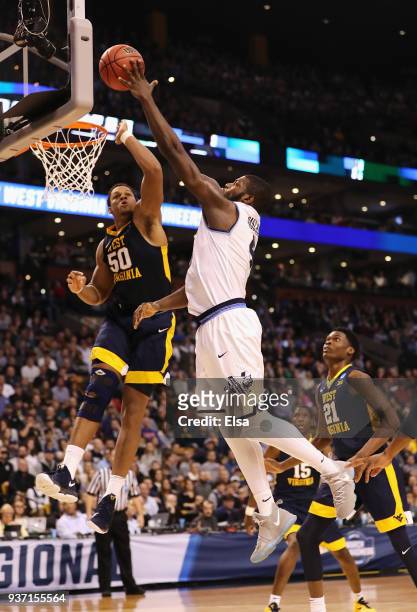 Eric Paschall of the Villanova Wildcats shoots the ball against Sagaba Konate of the West Virginia Mountaineers during the first half in the 2018...