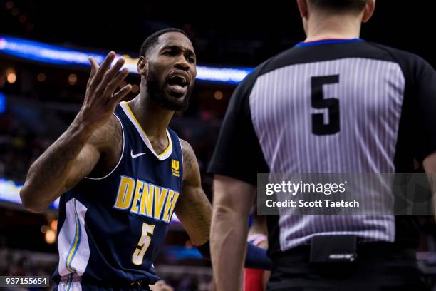 Will Barton of the Denver Nuggets reacts to referee Kane Fitzgerald against the Washington Wizards during the first half at Capital One Arena on...