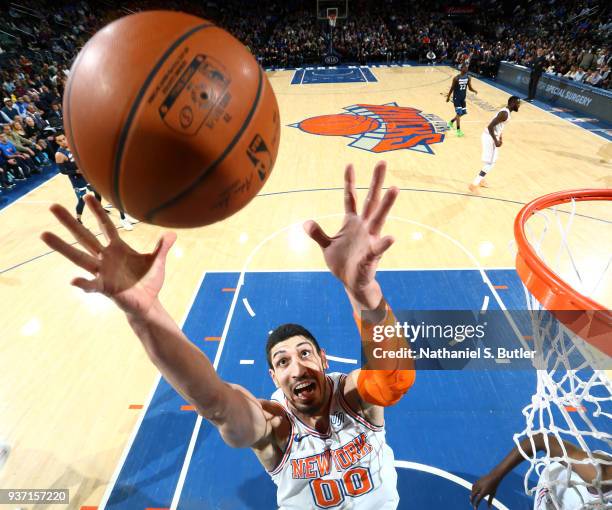 Enes Kanter of the New York Knicks grabs the rebound against the Minnesota Timberwolves on March 23, 2018 at Madison Square Garden in New York City,...