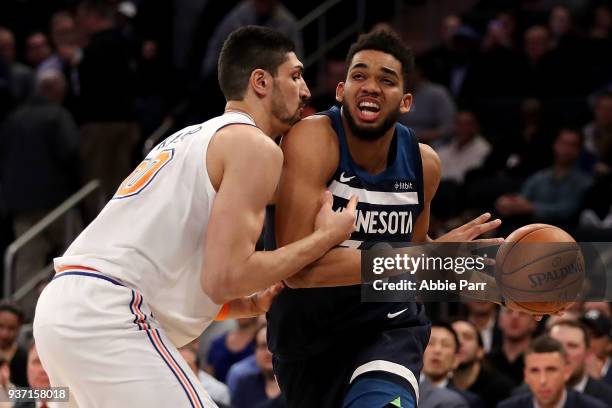 Karl-Anthony Towns of the Minnesota Timberwolves works against Enes Kanter of the New York Knicks in the first quarter during their game at Madison...