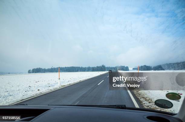 the way forward, driving in snow, austria - vsojoy stockfoto's en -beelden