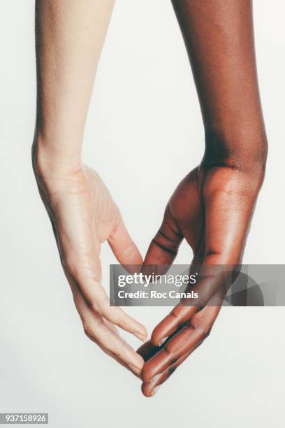 united hands - 2 guys black white stock pictures, royalty-free photos & images