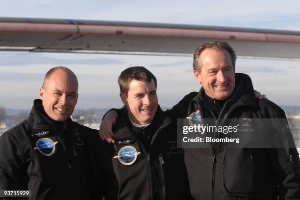 Bertrand Piccard, co-founder of the Solar Impulse project, left, Markus Scherdel, test pilot, center, and Andre Borschberg, co-founder of the Solar...