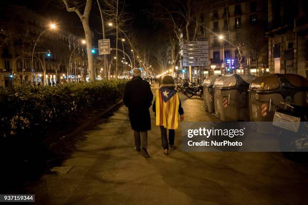 In Barcelona, Spain , people wrapped with esteladas or pro-independence flag go on the streets to protest against Spanish justice and in support of...