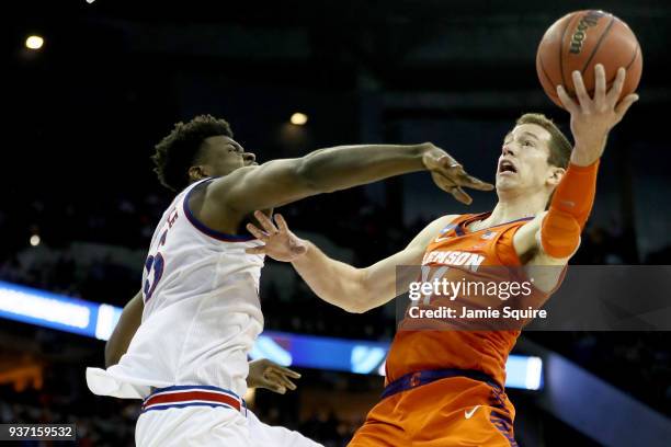 Udoka Azubuike of the Kansas Jayhawks defends David Skara of the Clemson Tigers during the second half in the 2018 NCAA Men's Basketball Tournament...