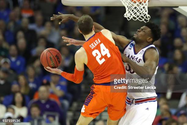 Udoka Azubuike of the Kansas Jayhawks defends David Skara of the Clemson Tigers during the second half in the 2018 NCAA Men's Basketball Tournament...