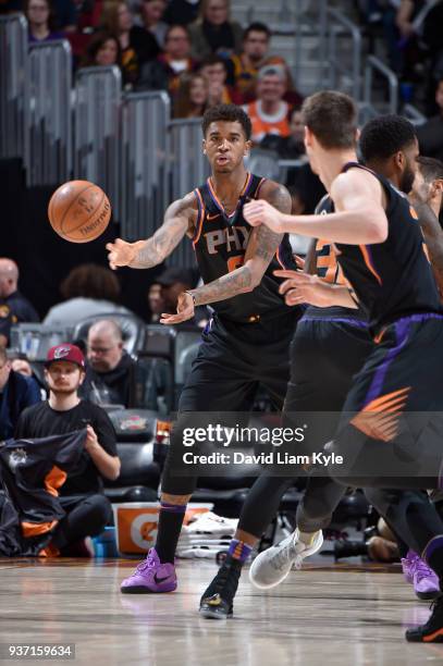 Marquese Chriss of the Phoenix Suns passes the ball against the Cleveland Cavaliers on March 23, 2018 at Quicken Loans Arena in Cleveland, Ohio. NOTE...