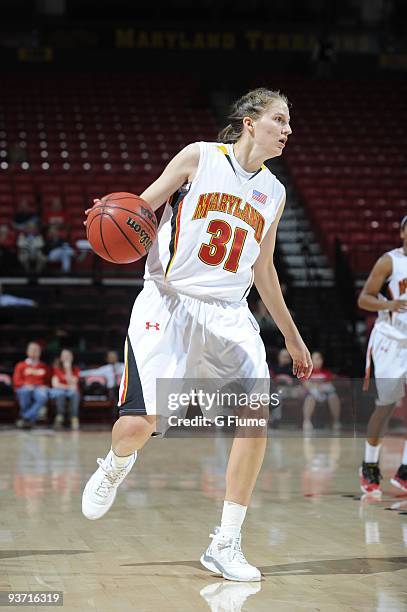 Lori Bjork of the Maryland Terrapins brings the ball up the floor against the New Hampshire Wildcats at the Comcast Center on November 16, 2009 in...