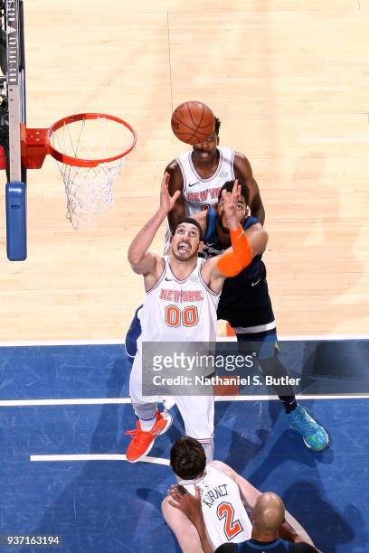 Enes Kanter of the New York Knicks grabs the rebound against the Minnesota Timberwolves on March 23, 2018 at Madison Square Garden in New York City,...