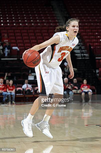 Lori Bjork of the Maryland Terrapins brings the ball up the floor against the New Hampshire Wildcats at the Comcast Center on November 16, 2009 in...