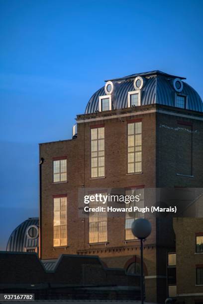 moody urban skylines: a candle factory - wandsworth stock pictures, royalty-free photos & images