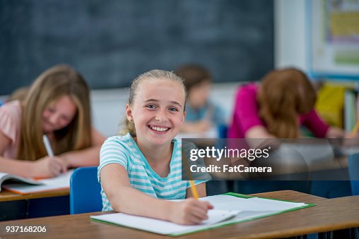 Good Looking Inclass Happy Girl In Class High-Res Stock Photo - Getty Images