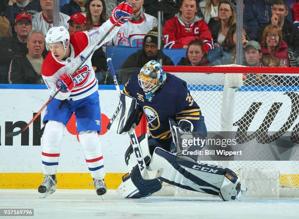 Brendan Gallagher of the Montreal Canadiens deflects the puck against Linus Ullmark of the Buffalo Sabres during an NHL game on March 23, 2018 at...