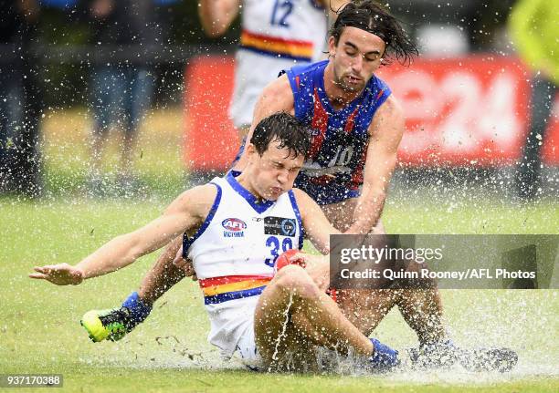 Matthew Briggs of Eastern and Charlie Whitehead of Oakleigh compete for the ball during the round one TAC Cup match between Oakleigh and Eastern at...