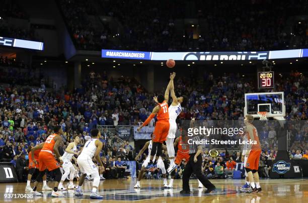 Oshae Brissett of the Syracuse Orange tips off against Marvin Bagley III of the Duke Blue Devils to start the first half in the 2018 NCAA Men's...