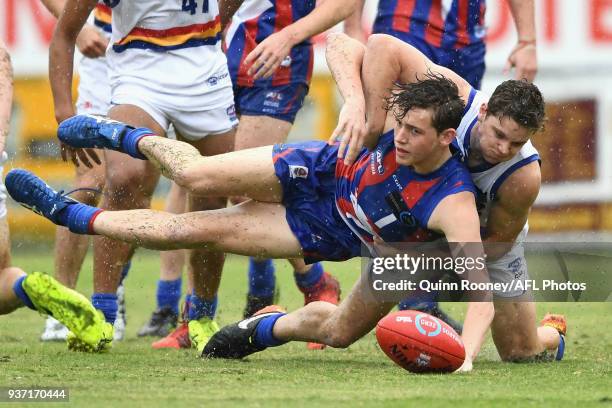 Riley Collier-Dawkins of Oakleigh is tackled compete for the ball during the round one TAC Cup match between Oakleigh and Eastern at Frankston Oval...