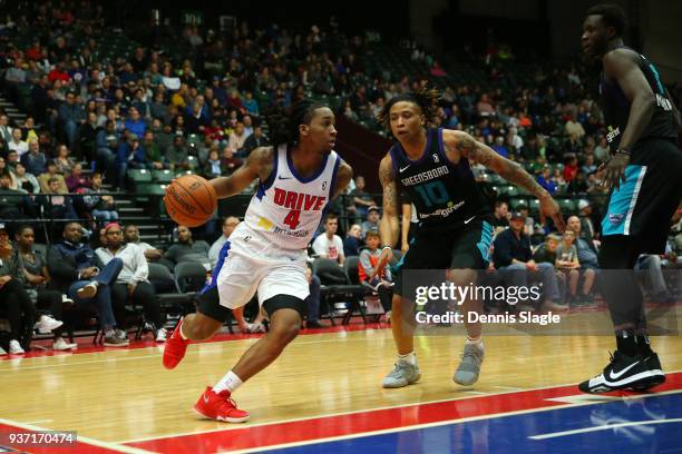 Kenneth Smith of the Grand Rapids Drive handles the ball during the game against the Greensboro Swarm at the DeltaPlex Arena on March 23, 2018 in...