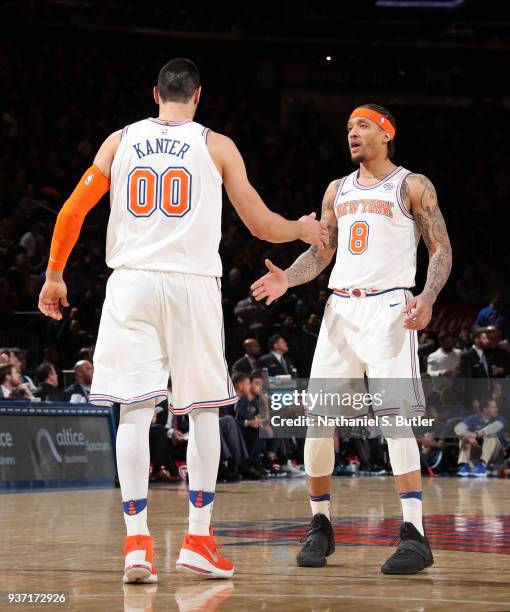 Enes Kanter and Michael Beasley of the New York Knicks high five during the game against the Minnesota Timberwolves on March 23, 2018 at Madison...