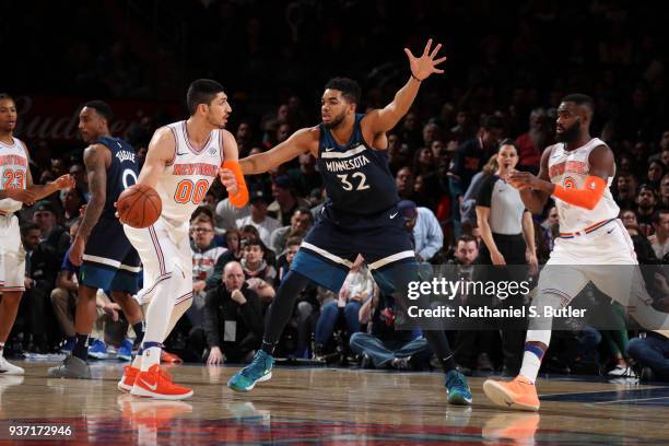 Karl-Anthony Towns of the Minnesota Timberwolves plays defense against Enes Kanter of the New York Knicks on March 23, 2018 at Madison Square Garden...