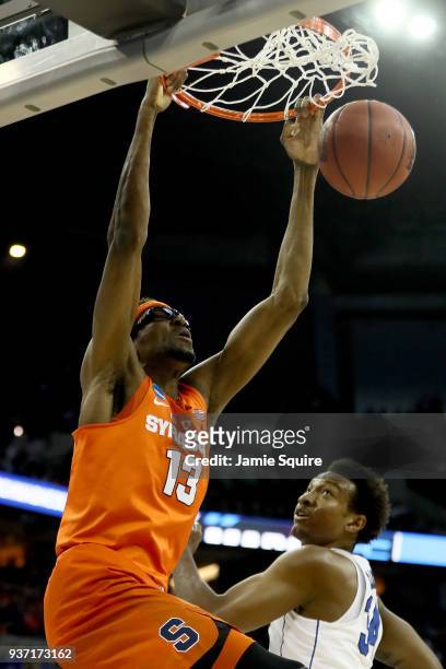 Paschal Chukwu of the Syracuse Orange dunks the ball against Wendell Carter Jr of the Duke Blue Devils during the first half in the 2018 NCAA Men's...