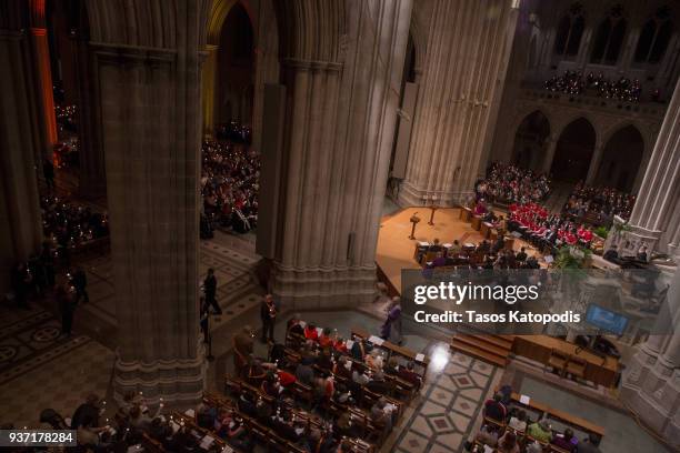 People take part in a candle light vigil at the Washington National Cathedral ahead of Saturday's March For Our Lives rally, March 23, 2018 in...