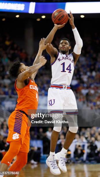 Kansas guard Malik Newman finds his spot as Clemson guard Shelton Mitchell defends on the play in the second half during the third round of the 2018...