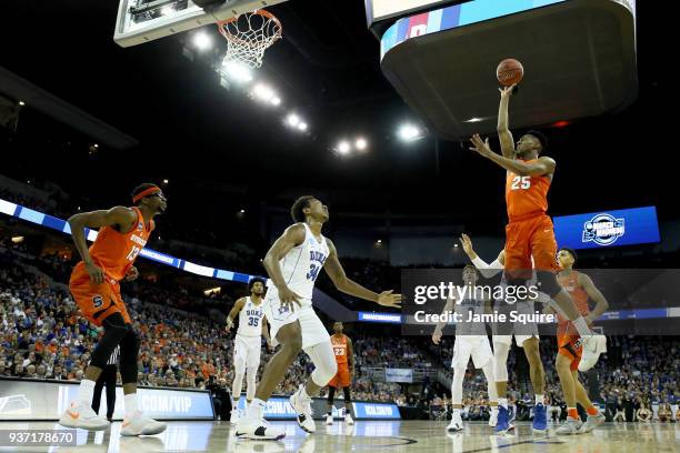 Tyus Battle of the Syracuse Orange shoots the ball against Wendell Carter Jr. #34 of the Duke Blue Devils in the 2018 NCAA Men's Basketball...