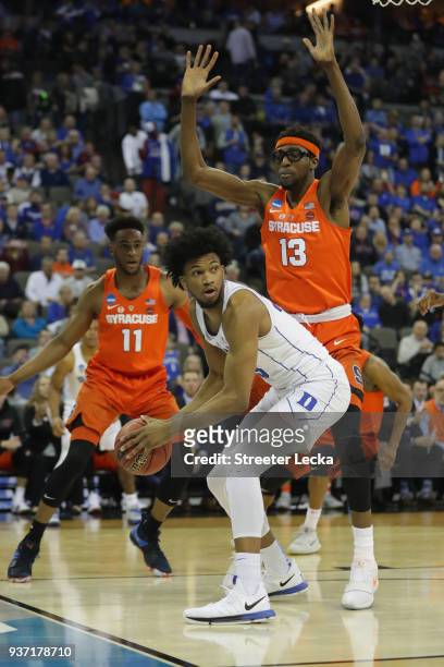 Paschal Chukwu of the Syracuse Orange defends Marvin Bagley III of the Duke Blue Devils during the first half in the 2018 NCAA Men's Basketball...